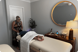 Lyn Madson performing Spinal Flow Therapy during a client session